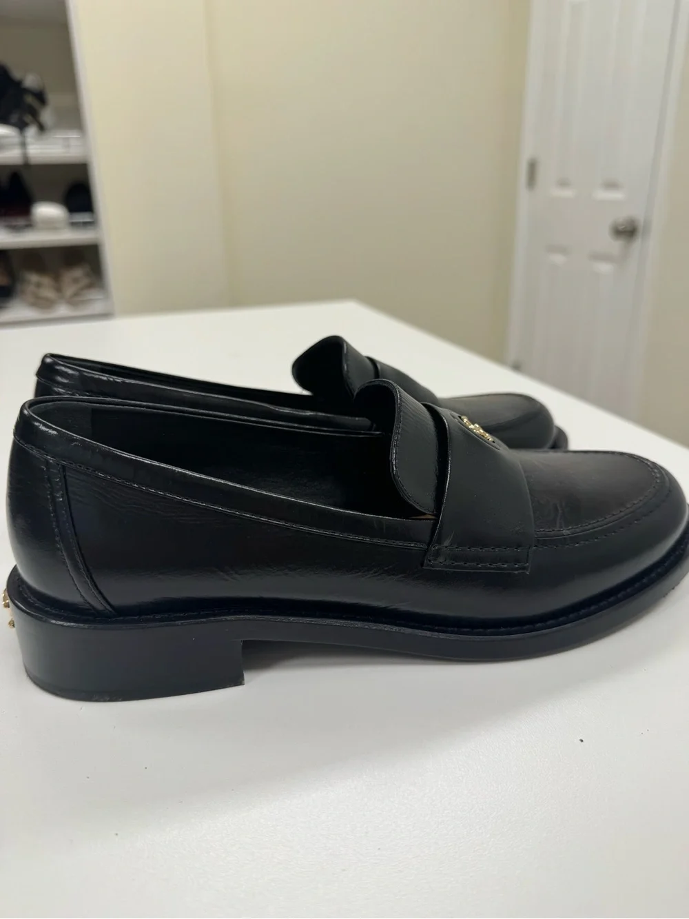 CHANEL Black Leather Loafers with Gold CC Medallions